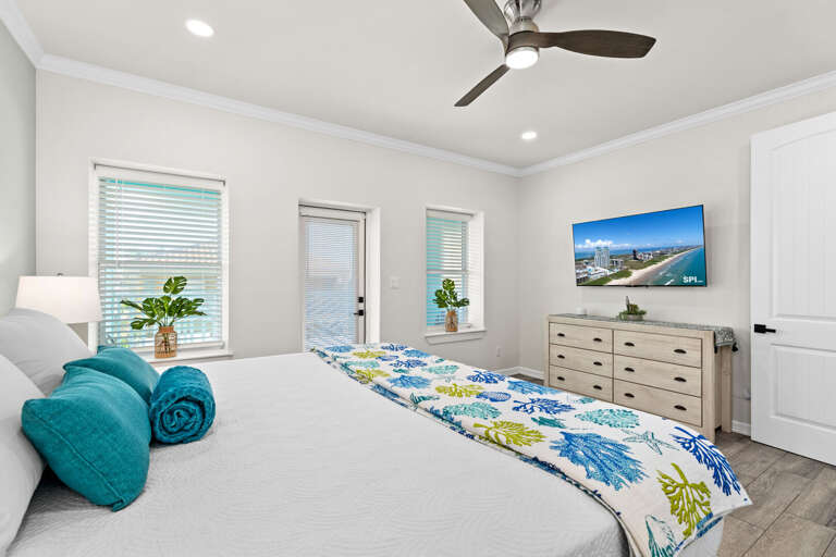 Third bedroom features a King bed, flat screen TV, private bathroom & access to the back balcony overlooking pool.