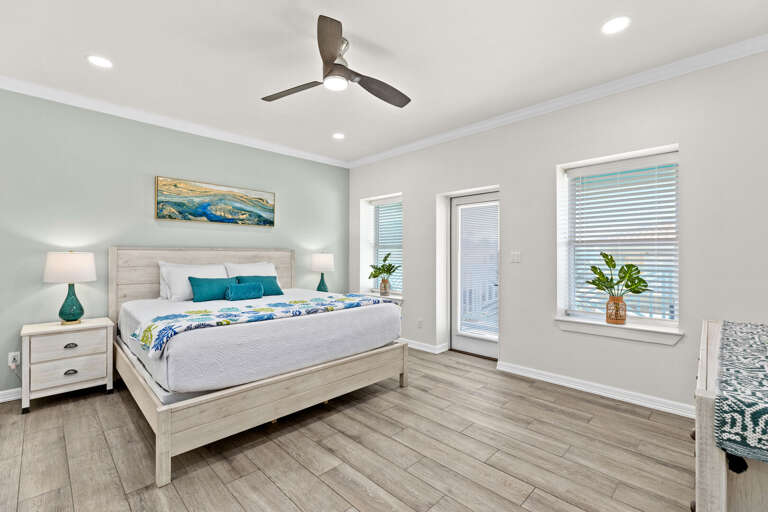 Third bedroom features a King bed, flat screen TV, private bathroom & access to the back balcony overlooking pool.