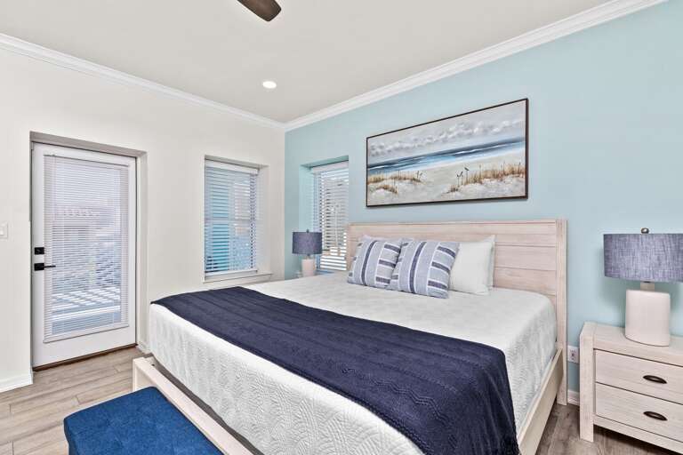 The fourth bedroom entails a King bed, flat screen TV, private bathroom & access to the back balcony overlooking pool.