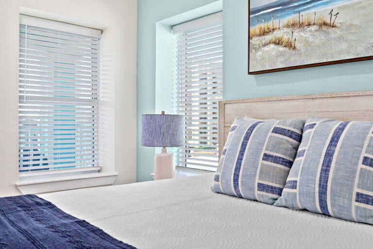 The fourth bedroom entails a King bed, flat screen TV, private bathroom & access to the back balcony overlooking pool.