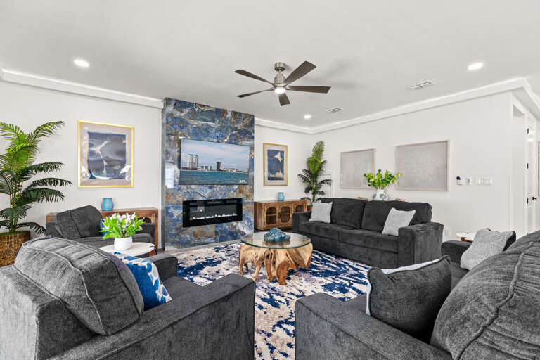 Your gorgeous living area provides ample seating around a large flat screen TV. (FIREPLACE NOT FOR GUEST USE)