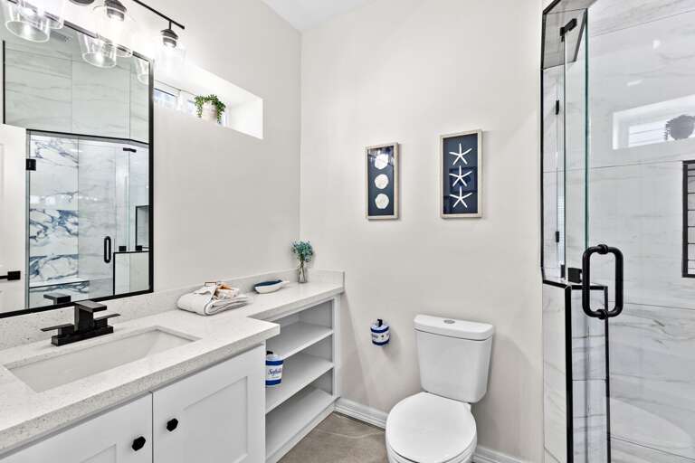 The private bathroom attached to the fourth bedroom entails a beautiful walk-in shower.