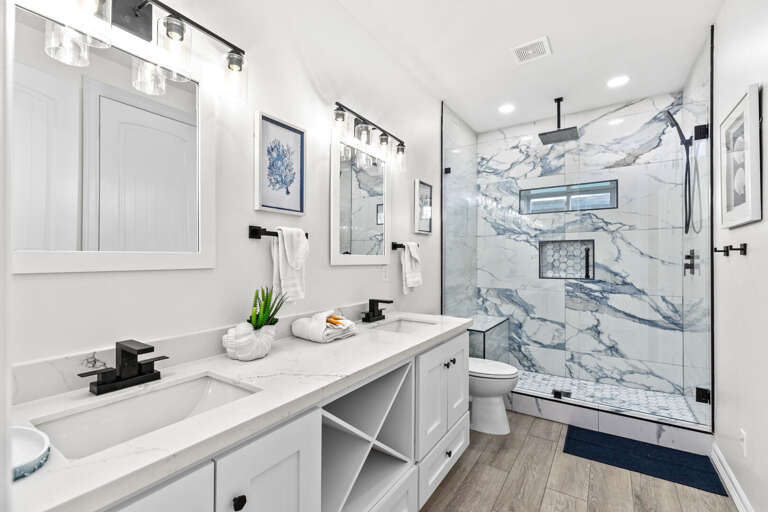 Shared guest bathroom can be accessed from the fifth bedroom or from the hallway just off the front entryway.