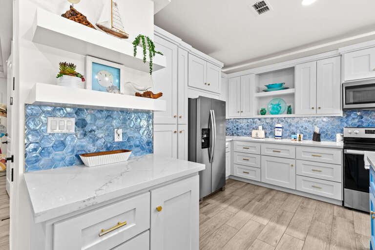 Spacious open concept kitchen with stainless steel appliances & ample cabinet space!