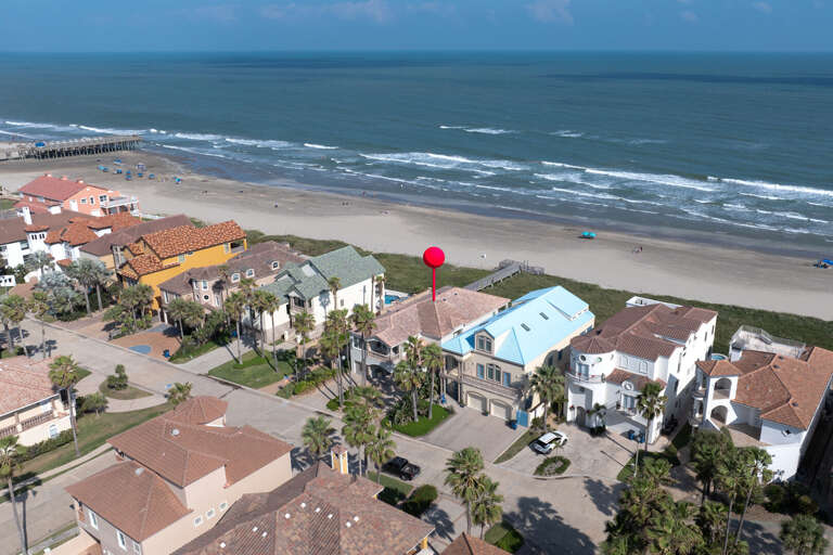 Welcome to 6416 Beach Drive! Aerial view of your beachfront home.