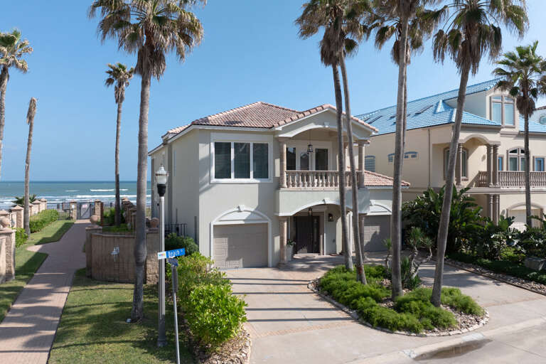 Front exterior with community beach access just steps away!
