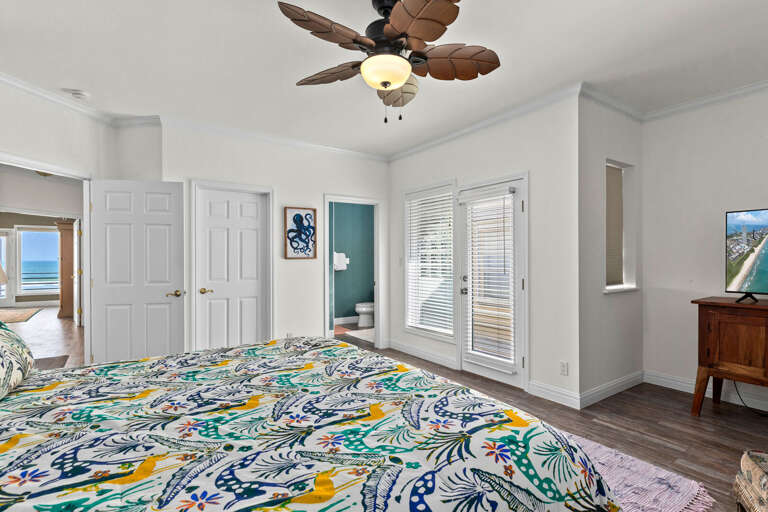 Guest bedroom with private balcony and ensuite bathroom.