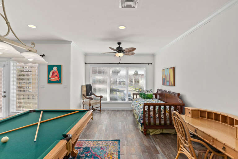 Pool Table and twin day beds featured in the 2nd floor living/game area