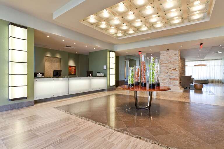 Spacious Lobby, Lengthy Lights, Lavish Floor, Gleaming Glass Tables
