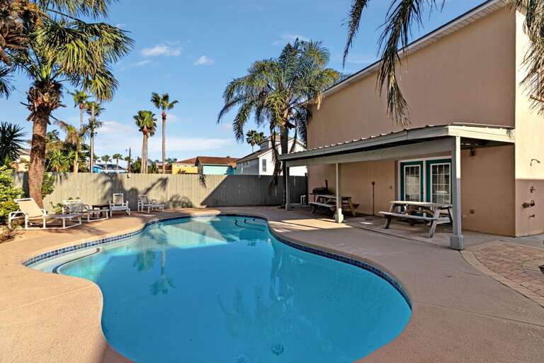 Palm-lined Poolside Patio, Pristine Pool In Foreground