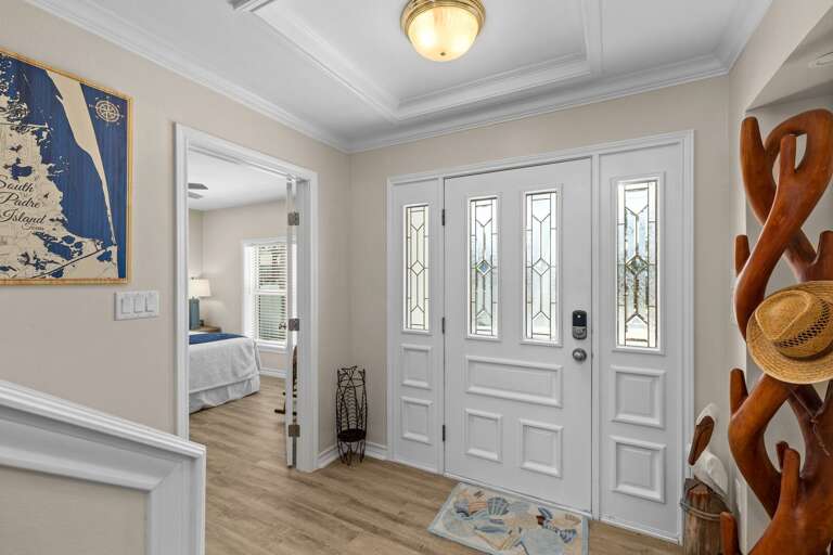 Front Entry foyer. (Guest Bedroom 3 pictured to the left)