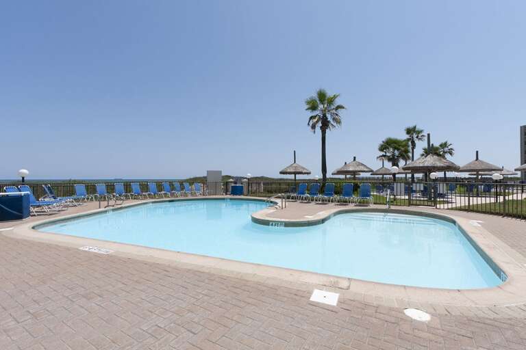 Relax by the pool while enjoying the coastal atmosphere and Gulf views beyond.