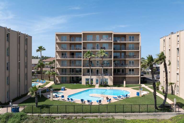 Aerial view from the beach to your complex! Building one is located on the left