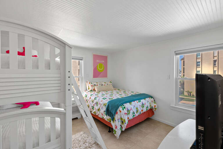 Guest bedroom features a Queen Bed and Twin bunk beds