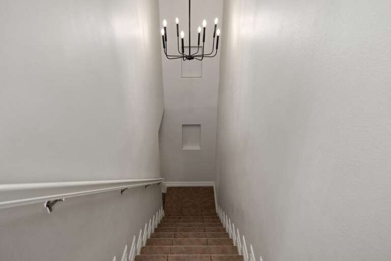 Interior staircase connecting the home's two levels.