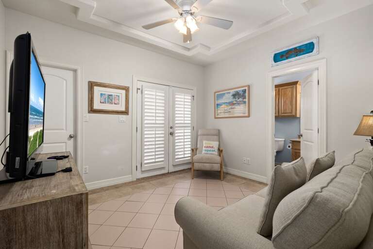Third guest bedroom has direct access to the pool and patio area,  and access to the shared guest bathroom.
