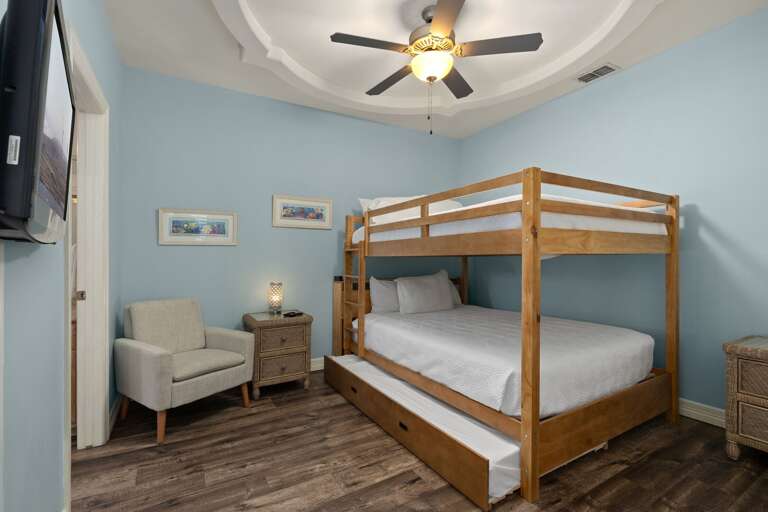 Second guest room with queen over queen bunk beds, plus twin trundle.