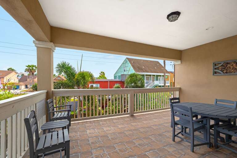 Spacious second-floor terrace featuring an outdoor dining set—ideal for morning coffee or evening meals with a view.