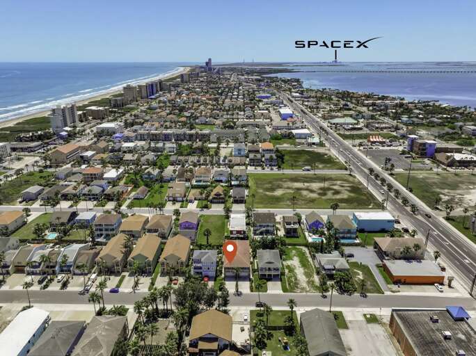 Aerial of your townhome with Space X right in your backyard to witness the next launch!