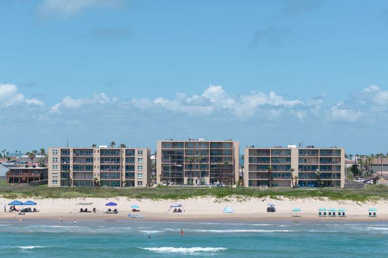 Beachfront exterior view of Beach House Condominiums!