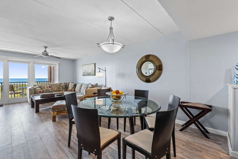 Open-concept dining space with seating for six, perfect for family meals overlooking the Gulf of Mexico.