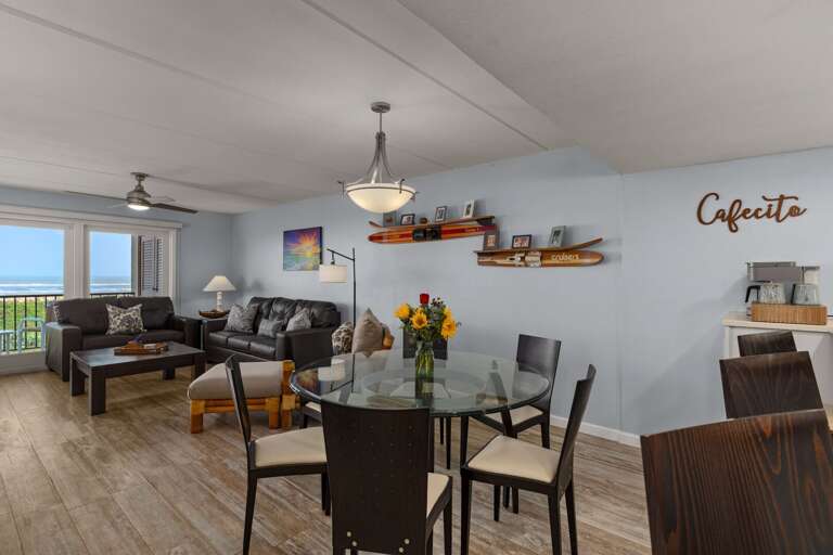Open-concept dining space with seating for six, perfect for family meals overlooking the Gulf of Mexico.