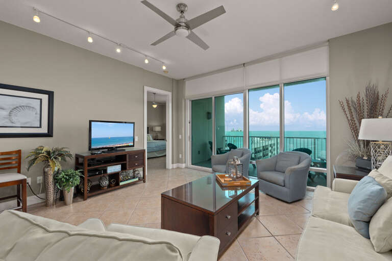 Serene Seashore Vacation Rental: Spacious Living Room With Sea View Balcony