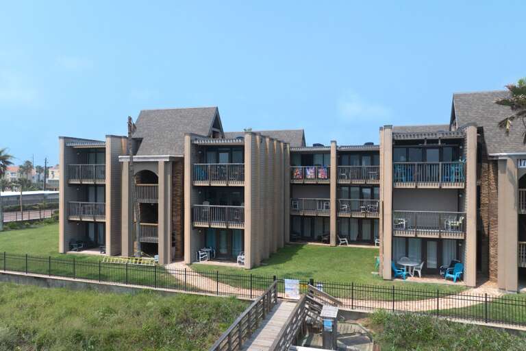 Exterior view of the Marisol condominium buildings, offering a relaxed coastal vibe just steps from the Gulf of Mexico.