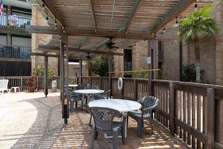 Relax poolside at Marisol with ample lounge chairs, palm-lined surroundings, and a tranquil atmosphere ideal for sunbathing or unwinding