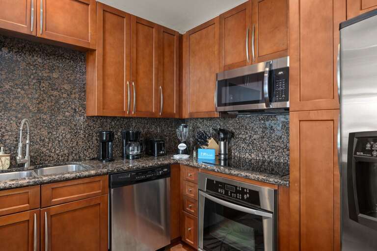 Cook in style in this fully equipped kitchen with high end appliances, granite countertops, and plenty of space for meal preparation.