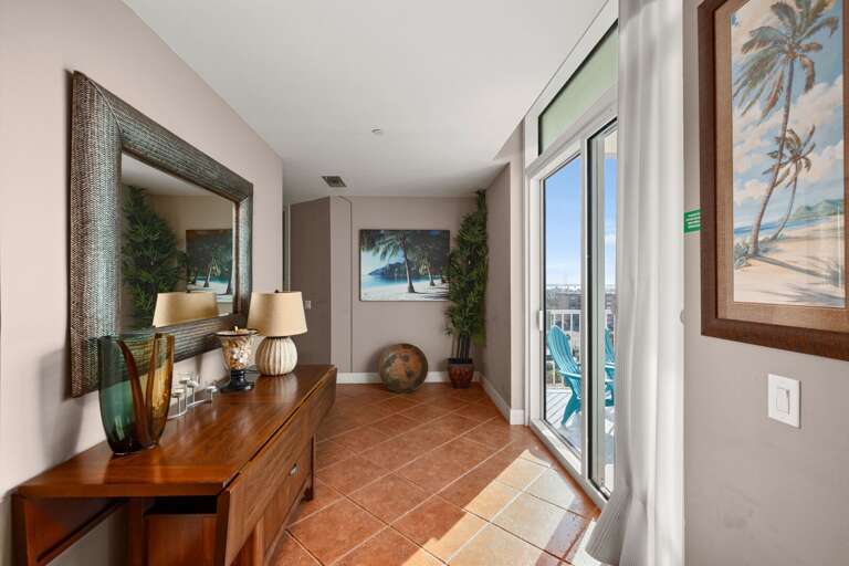 Entry foyer of condo with balcony access to the Bay Area.