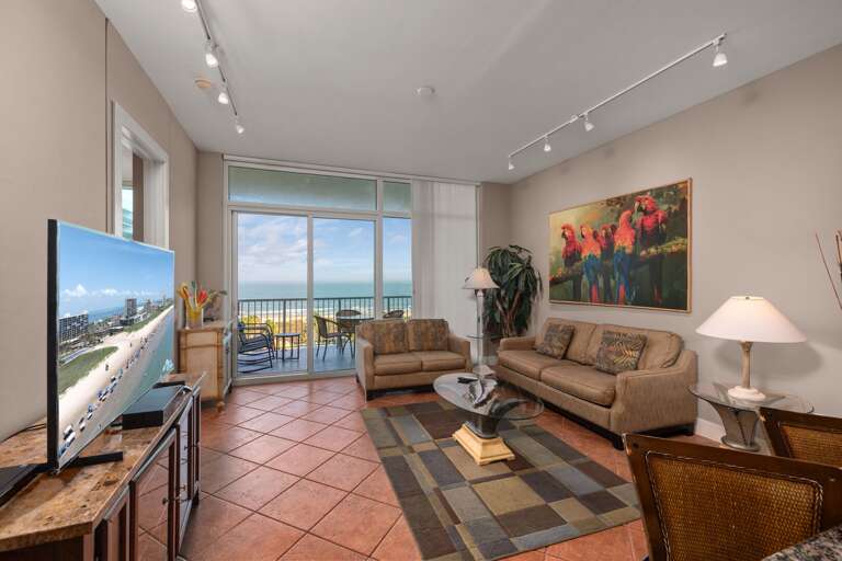 Spacious and beautifully furnished living area with panoramic Gulf view. Perfect for relaxation.