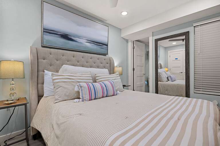 The comfortable primary bedroom is designed for restful nights after a day in the sun and is equipped with a queen bed.