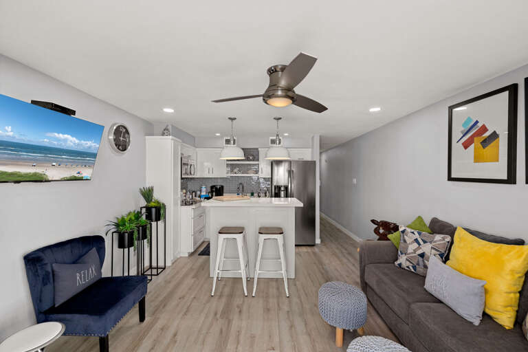 The condo offers an open layout that keeps the living room and kitchen connected for easy gathering.