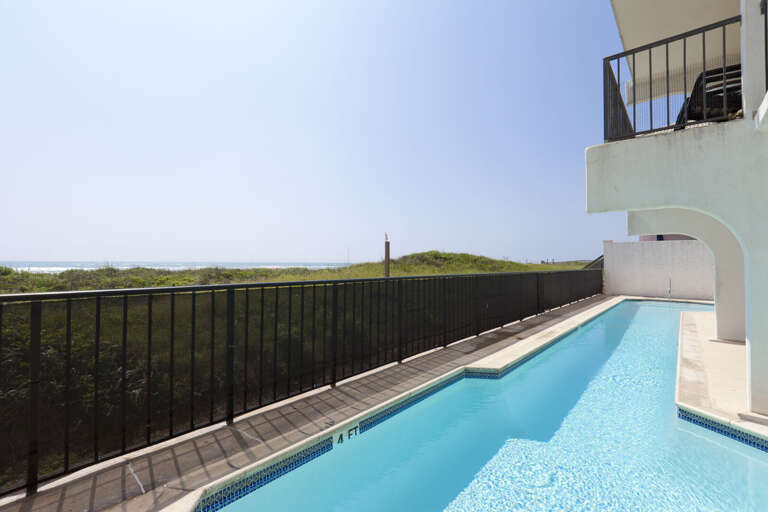 You'll love taking a refreshing dip in the beachfront pool with the Gulf just beyond.