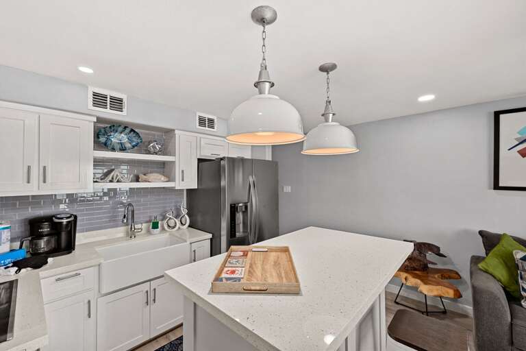 You'll have everything you need in the modern kitchen with island seating and stainless steel