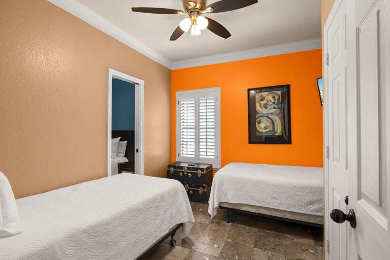 In the third bedroom you'll find two twin beds and a TV for relaxing after a fun-filled day.