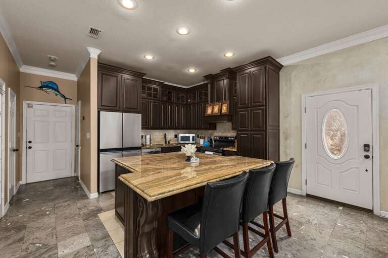 Cook, entertain, and make memories in this beautifully designed kitchen with ample space for everyone to gather.
