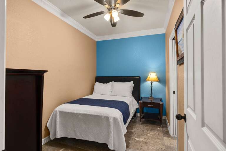 This cozy second bedroom gives you a comfortable place to rest, featuring a full size bed.