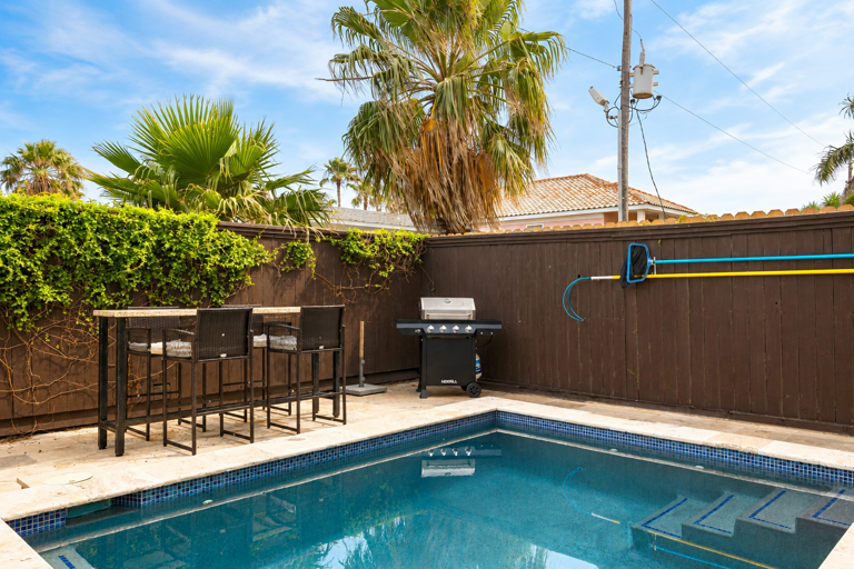 Fire up the grill and dine outdoors with bar seating.
