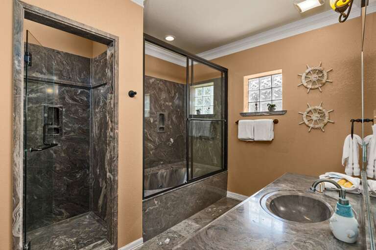 You can refresh and unwind in this spacious master bathroom, complete with a walk-in shower and large soaking bathtub.