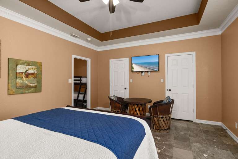 Spacious bedroom with seating area and bonus bunk room access