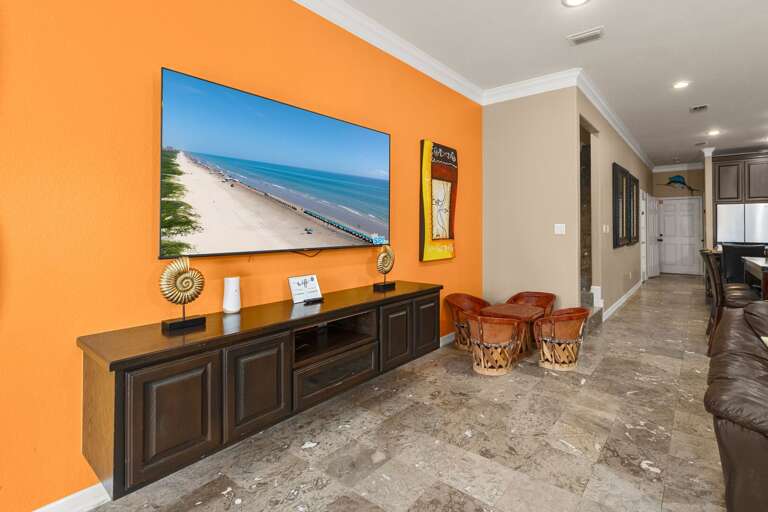 Spacious living area with TV and easy access to the kitchen
