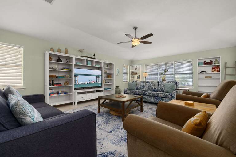Comfortable living room with large TV and plenty of seating for relaxing evenings