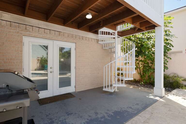 Covered patio area with grill
