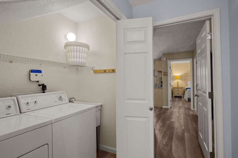 Laundry closet with washer and dryer located on the ground floor