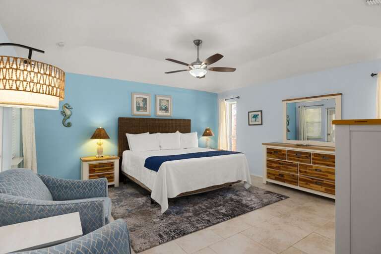 A spacious master suite with king bed, your retreat after a long day in the sun