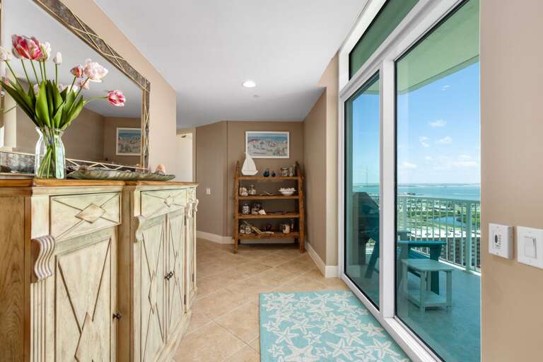A bright entryway leading toward panoramic Gulf views and coastal comfort