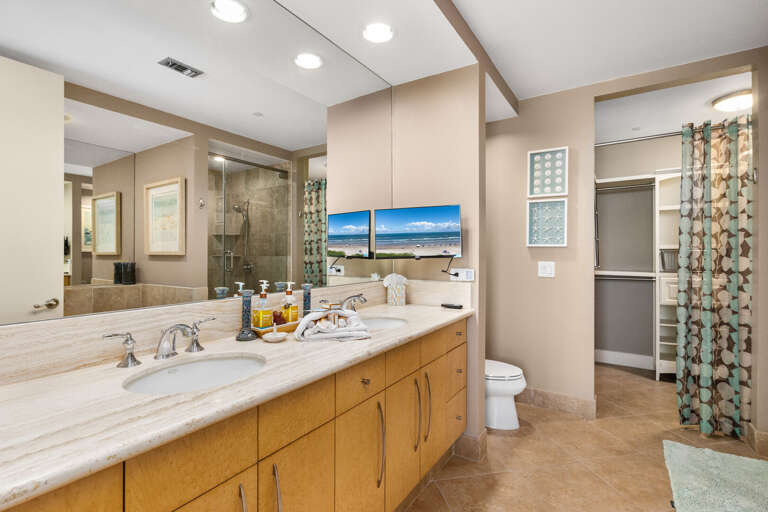 Dual vanities, soaking tub, and walk-in shower in the private ensuite bath