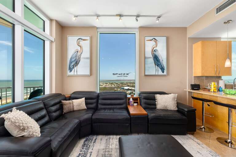 Gather together with wraparound Gulf views and SpaceX launch sights from the living room